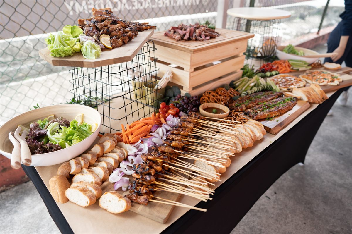 Sunday Roast BBQ spread with grilled meats, salads, breads, and table styling at a private gathering