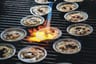 Scallops being torched at the grill